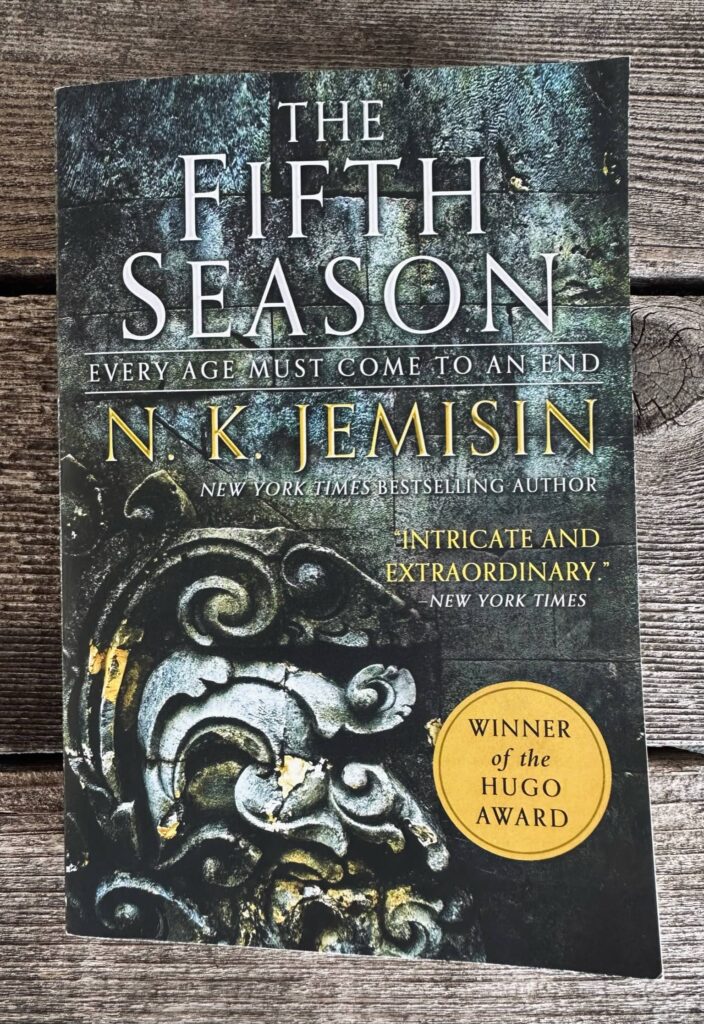 Book One of the Inheritance Trilogy titled "The Fifth" Season by N.K. Jemisin