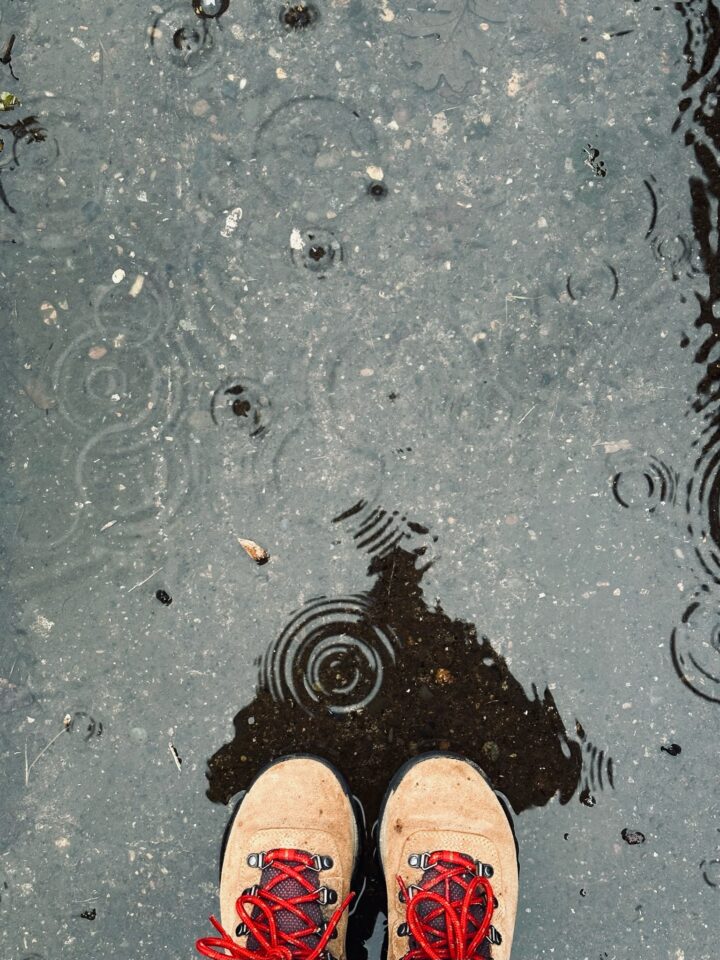 Ripples in a puddle and Sue's boots at the bottom. Posted in It's a New Year on Dropping Rocks.