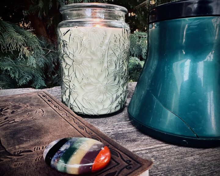 A Green plastic to-go coffee mug with an old sticker and missing handle. A Cup Full of the Past, posted by Sue Evergreen.