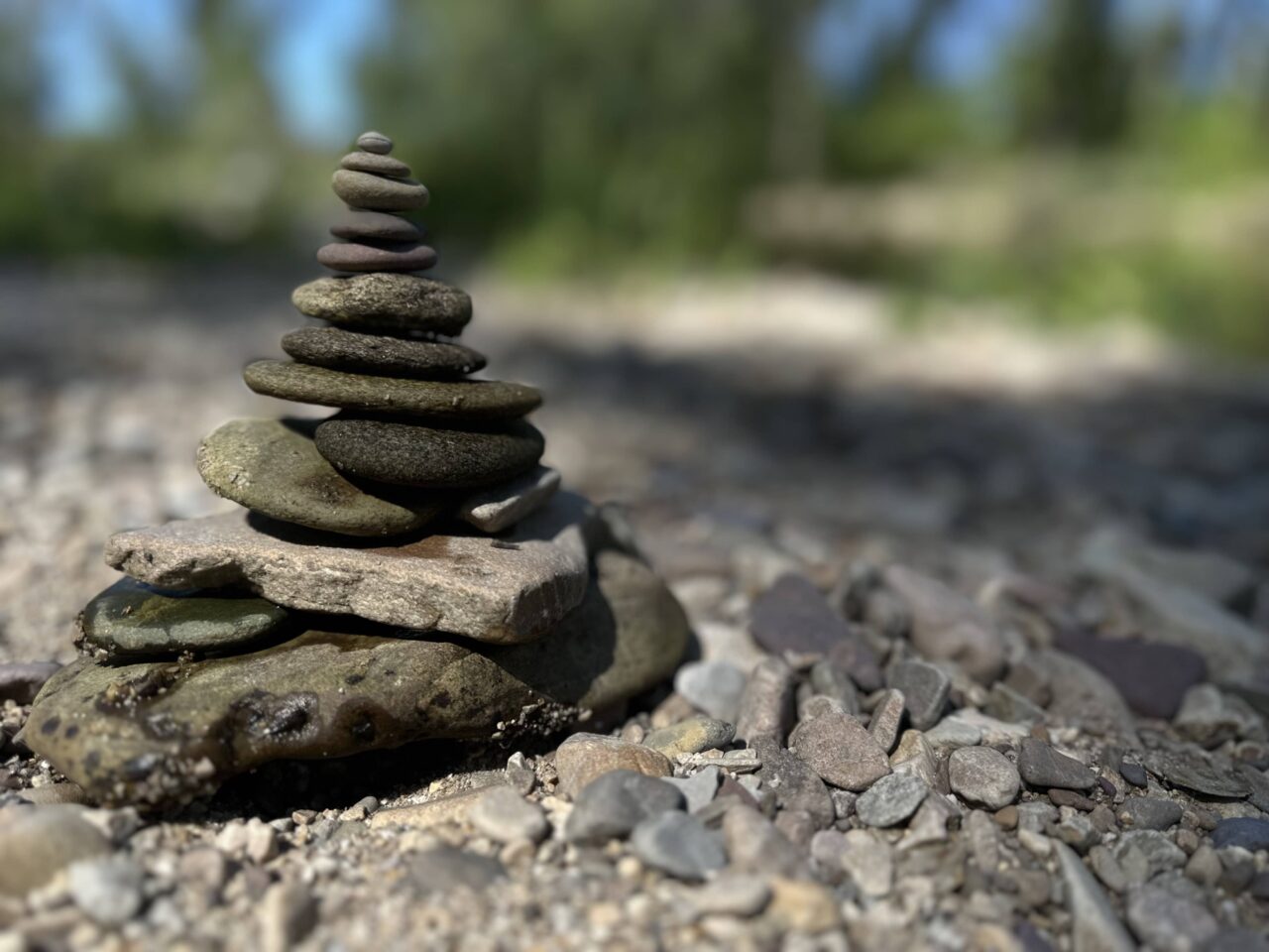 A stack of balanced river rocks placed by Sue Evergreen in a post about removing rocks for mindfulness