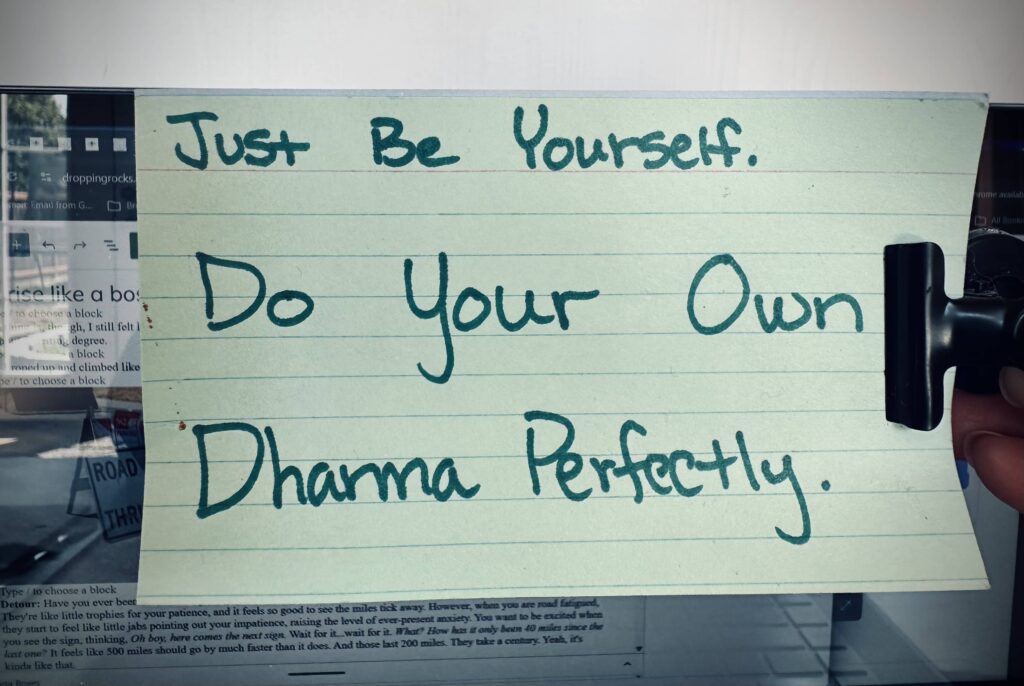 A green notecard with the words 'Just be yourself. Do your own dharma perfectly" written in green marker. Copyright Sue Evergreen.